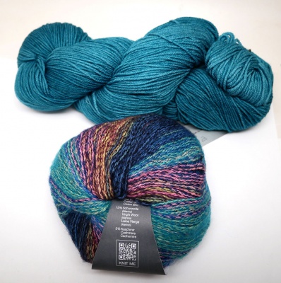 The kit will include one skein of Fanfare (top) and two of Vermont (bottom).