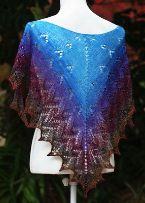 The photos on this page show the original piece knit by Nim.